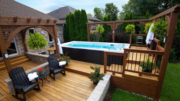 backyard swim spa deck-side with pergola