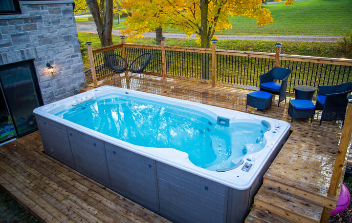 backyard swim spa with custom deck